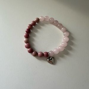 Half pink half mauve heart bracelet.